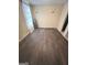 Bedroom with new hardwood flooring and space for remodel at 11657 Flemming Ct, Hampton, GA 30228