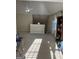 Large bonus room or loft area with vaulted ceiling, carpet, and natural light at 11657 Flemming Ct, Hampton, GA 30228