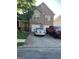 Two-story brick home with stone accents, a two-car garage, and driveway parking at 11657 Flemming Ct, Hampton, GA 30228