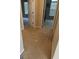 Hallway with neutral walls and carpet flooring leading to multiple rooms at 11657 Flemming Ct, Hampton, GA 30228
