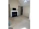 Bright living room with a fireplace, a ceiling fan, and neutral-colored walls and carpet at 11657 Flemming Ct, Hampton, GA 30228