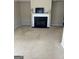 Spacious living room featuring a fireplace and neutral-toned carpeting at 11657 Flemming Ct, Hampton, GA 30228