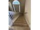 View from the top of the staircase down to the front door at 11657 Flemming Ct, Hampton, GA 30228