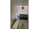 Open staircase with high ceilings, art and a ceiling fan at 11657 Flemming Ct, Hampton, GA 30228