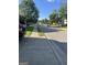 Residential street featuring mature trees, sidewalks, and parked cars at 11657 Flemming Ct, Hampton, GA 30228