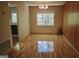 Dining room with laminate wood flooring, wood paneling, chandelier, and ample natural light at 1381 Ne Normandy Ne Dr # 4, Atlanta, GA 30306