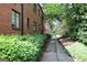 Brick apartment building with a walking path and green landscaping at 1381 Ne Normandy Ne Dr # 4, Atlanta, GA 30306