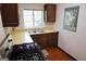 Cozy kitchen featuring a gas range, laminate countertops, and ample storage at 1381 Ne Normandy Ne Dr # 4, Atlanta, GA 30306