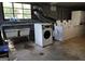 A shared laundry room with washing machines, a sink, and a window at 1381 Ne Normandy Ne Dr # 4, Atlanta, GA 30306