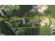 Aerial view of a large lot outlined with a yellow border showing its size and potential at 78 N Pomona Rd, Hampton, GA 30228