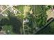 Aerial view of a house with lush surrounding trees and greenery showcasing the expansive property at 78 N Pomona Rd, Hampton, GA 30228