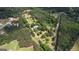 Aerial view of a home nestled among lush trees and greenery, showcasing a peaceful, wooded setting at 78 N Pomona Rd, Hampton, GA 30228