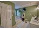 This bathroom features a bathtub, a television, and ample towel storage at 78 N Pomona Rd, Hampton, GA 30228
