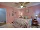 Comfortable bedroom with a ceiling fan, plush bedding, and decor at 78 N Pomona Rd, Hampton, GA 30228