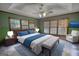 Comfortable bedroom offers a serene retreat with a ceiling fan and abundant natural light at 78 N Pomona Rd, Hampton, GA 30228