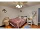 Bedroom with hardwood floor, ceiling fan, bed, and natural light at 78 N Pomona Rd, Hampton, GA 30228