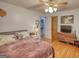 Bedroom with hardwood floors and a ceiling fan has plenty of space for furniture at 78 N Pomona Rd, Hampton, GA 30228