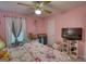 Charming bedroom with whimsical wall art, TV, and decor at 78 N Pomona Rd, Hampton, GA 30228