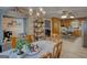 Cozy dining area featuring wood floors, chandelier, and ample storage cabinets at 78 N Pomona Rd, Hampton, GA 30228