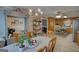 Dining room with a chandelier, shelving, a table, and a view into the kitchen at 78 N Pomona Rd, Hampton, GA 30228
