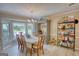 Dining room with a chandelier, shelving, and a large window at 78 N Pomona Rd, Hampton, GA 30228