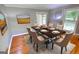 Elegant dining room with hardwood floors and ample natural light from the windows at 78 N Pomona Rd, Hampton, GA 30228