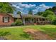 Quaint single-story brick and siding home featuring a cozy front porch at 78 N Pomona Rd, Hampton, GA 30228