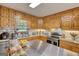 Kitchen featuring wood cabinetry, stainless steel appliances, and countertops at 78 N Pomona Rd, Hampton, GA 30228