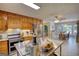 Kitchen featuring wood cabinetry, stainless steel appliances, butcher block countertops and dining area at 78 N Pomona Rd, Hampton, GA 30228