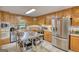 Traditional kitchen featuring wood cabinetry, stainless steel appliances and butcher block countertops at 78 N Pomona Rd, Hampton, GA 30228