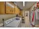 Laundry room with a washer, dryer, cabinets, and a utility sink at 78 N Pomona Rd, Hampton, GA 30228