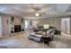 Cozy living room with a stone fireplace, plush seating, and ample natural light at 78 N Pomona Rd, Hampton, GA 30228