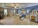 Spacious main bedroom featuring a tray ceiling, ceiling fan and multiple windows at 78 N Pomona Rd, Hampton, GA 30228