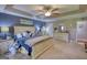 Spacious main bedroom features a trey ceiling, a ceiling fan, and a large window for natural light at 78 N Pomona Rd, Hampton, GA 30228