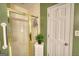 Bathroom shower features a cabinet for storage and a towel rack at 78 N Pomona Rd, Hampton, GA 30228