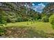 Lush trees dot a large, grassy lawn at 78 N Pomona Rd, Hampton, GA 30228