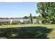 Large grassy backyard with neighboring houses in the background, creating a sense of community at 239 Ferguson Ave, Locust Grove, GA 30248