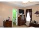 Bedroom featuring laundry room and television at 239 Ferguson Ave, Locust Grove, GA 30248