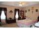 Bedroom featuring ceilings fan and two windows at 239 Ferguson Ave, Locust Grove, GA 30248