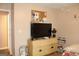 Bedroom featuring dresser and television at 239 Ferguson Ave, Locust Grove, GA 30248