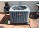 Close up shot of a modern outdoor air conditioning unit set against a brick patio at 239 Ferguson Ave, Locust Grove, GA 30248