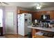 Functional kitchen features wood cabinets, ample counter space, and modern appliances at 239 Ferguson Ave, Locust Grove, GA 30248
