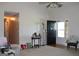Bright and airy living room featuring hardwood floors and a view of the front door at 239 Ferguson Ave, Locust Grove, GA 30248