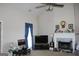 Spacious living room featuring a fireplace and large windows for natural light at 239 Ferguson Ave, Locust Grove, GA 30248