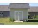 Close-up of a backyard storage shed with double doors and a gray shingled roof at 239 Ferguson Ave, Locust Grove, GA 30248