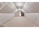 Spacious unfinished attic with drywall, carpet, and bright lighting at 125 Lake Park Dr, Sharpsburg, GA 30277