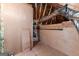 View of unfinished attic space with wooden beams and installed duct work at 125 Lake Park Dr, Sharpsburg, GA 30277