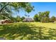 Extensive backyard featuring lush lawn and mature trees at 125 Lake Park Dr, Sharpsburg, GA 30277