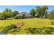 Screened porch overlooks lush backyard with mature trees at 125 Lake Park Dr, Sharpsburg, GA 30277