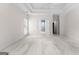 Bright and spacious bedroom features neutral carpet, tray ceilings, a ceiling fan, and ensuite bathroom access at 125 Lake Park Dr, Sharpsburg, GA 30277